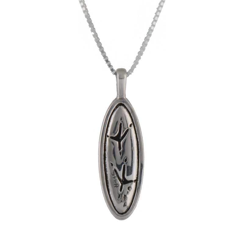 The back of the Heron Pendant shows the heron's tracks in the mud.