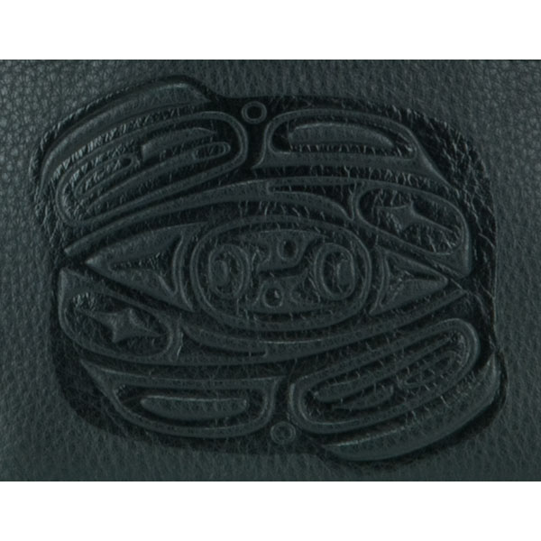 The bovine leather pouch is embossed with Corrine Hunt's own raven design.